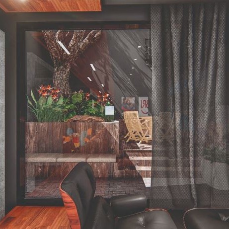 Vista da sala de projeção para a área de estar / atendimento externo.